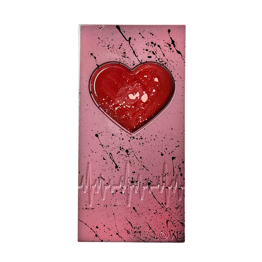 Pink chocolate bar with a red heart in the center on a white background