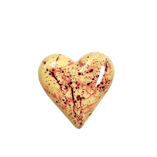 Heart-shaped gold pendant on a white background