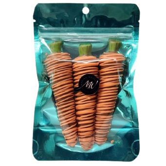 Packaged carrot-shaped gummy candies in a clear plastic bag with a blue background