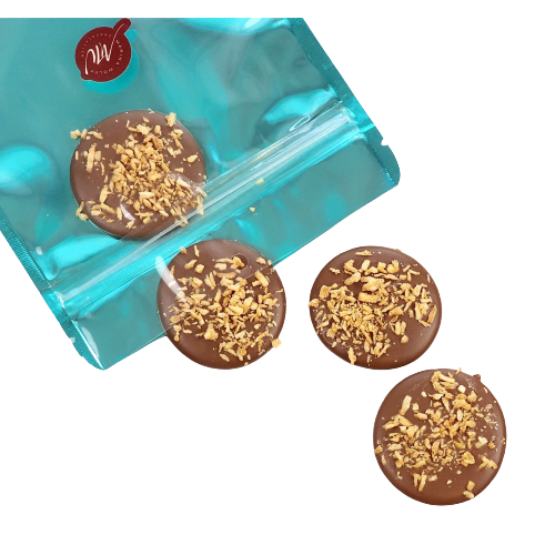 Cyan pouch with 4 milk chocolate disks topped with toasted coconut 