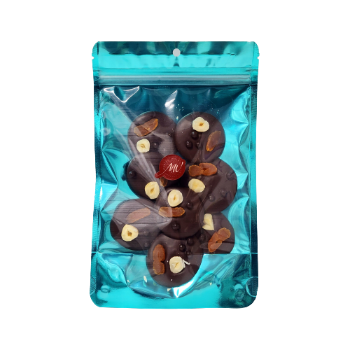 Cyan stand-up pouch with 8 dark chocolate disks topped with a slice of apricot, hazelnut, and dark chocolate balls