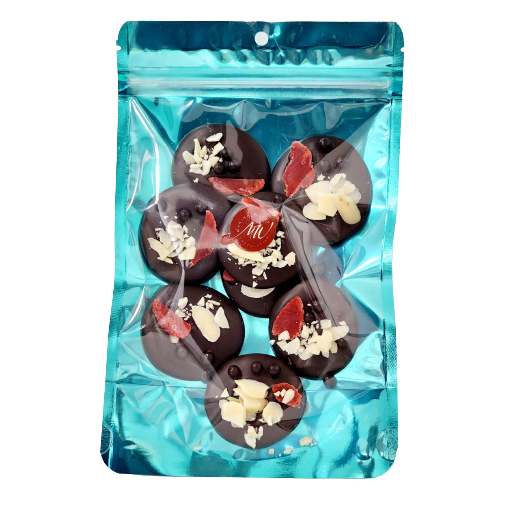 Cyan stand-up pouch with 8 dark chocolate disks topped with dried strawberry, almond, and dark chocolate balls