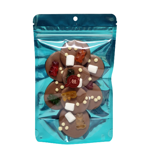 Cyan stand-up pouch with 8 milk chocolate disks inside topped with gummy bears, and mini-marshmallows