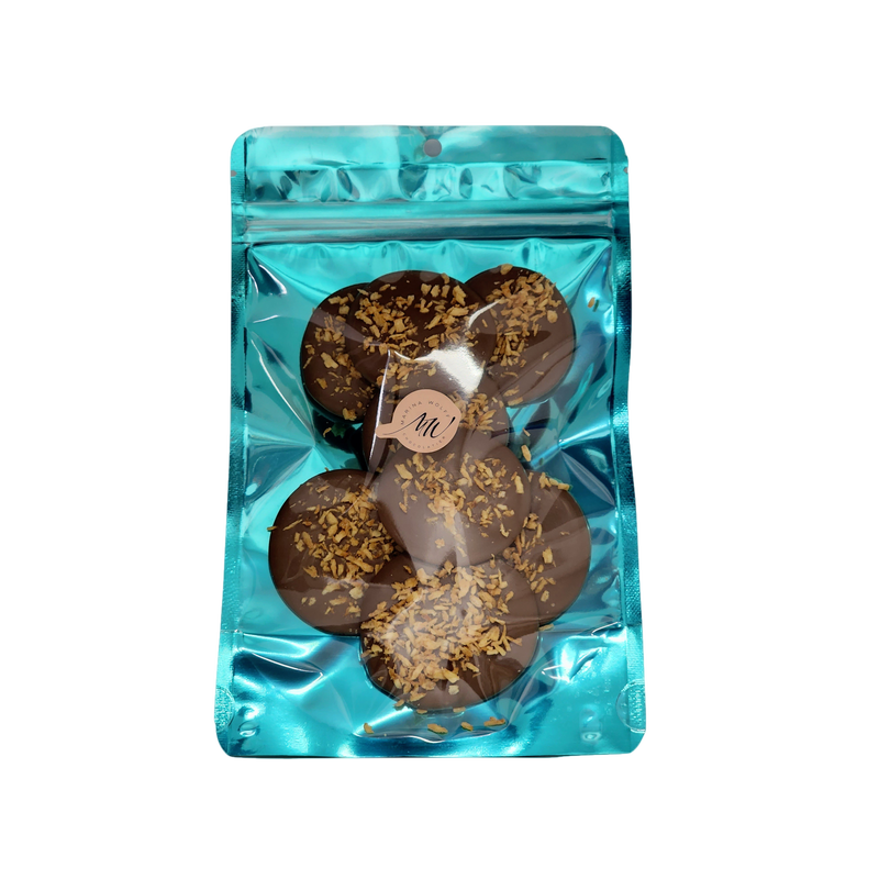 Cyan stand-up pouch with 8 milk chocolate disks inside topped with toasted coconut